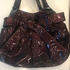 Wine color metallic patent leather Kooba purse